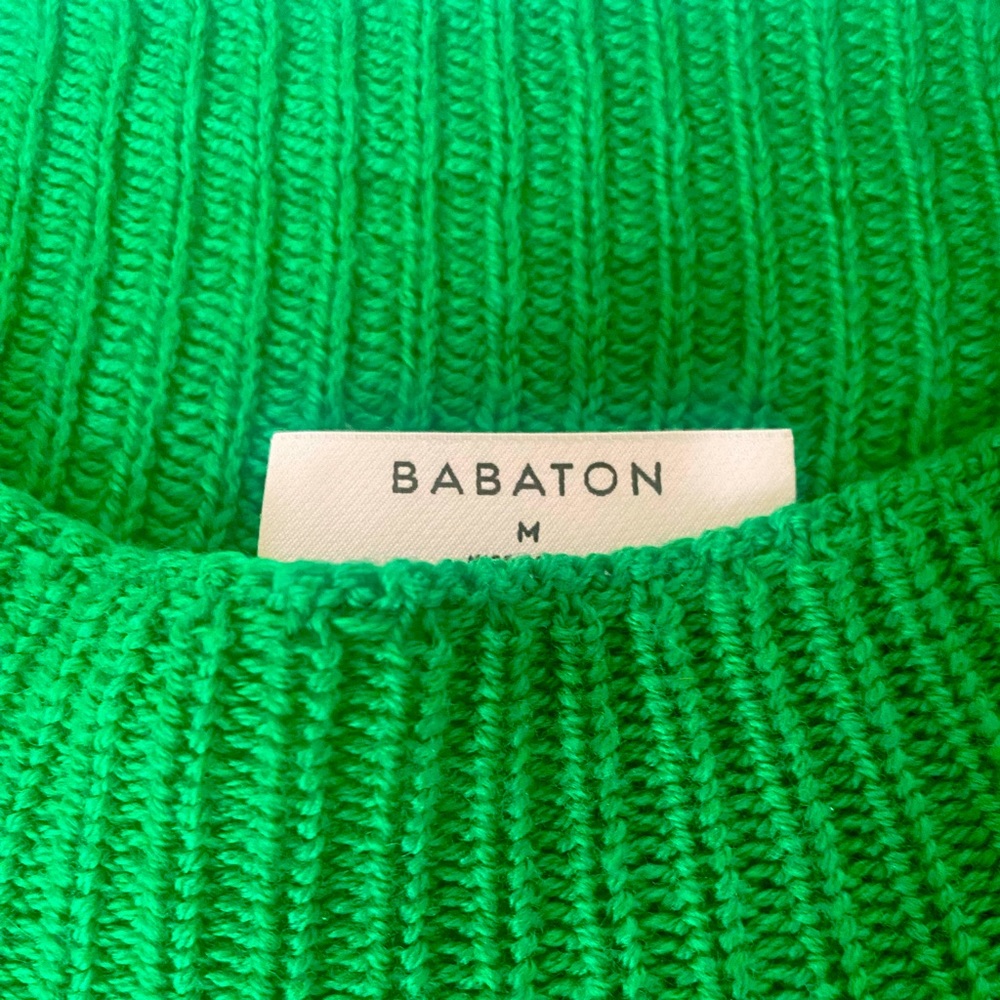 Green knit sweater top. Bold color with bold style including shoulder pads.